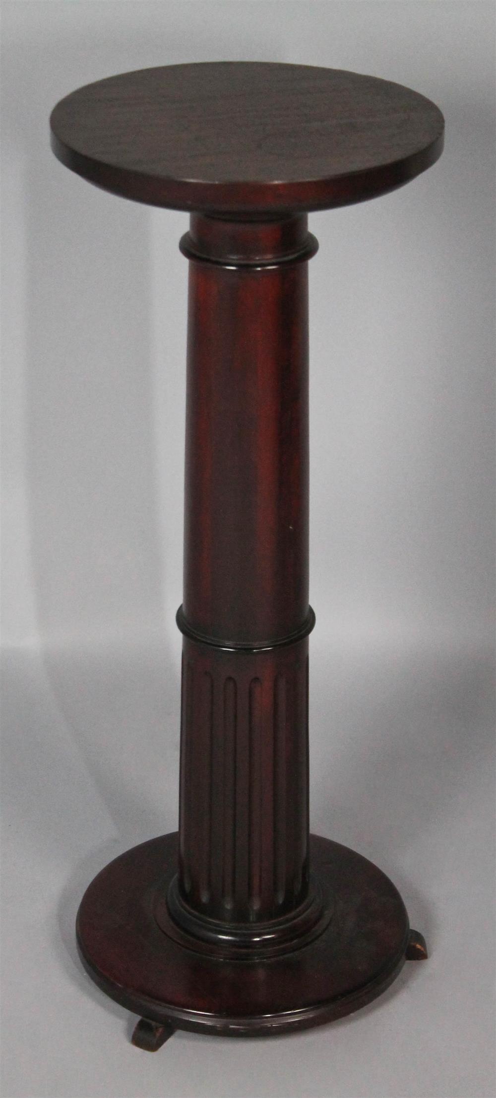 Appraisal: CLASSICAL STYLE MAHOGANY PEDESTAL having a round platform over ring