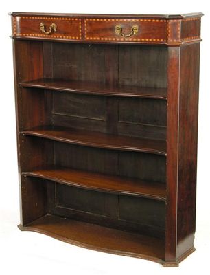 Appraisal: A late Victorian mahogany serpentine front open bookcase the top