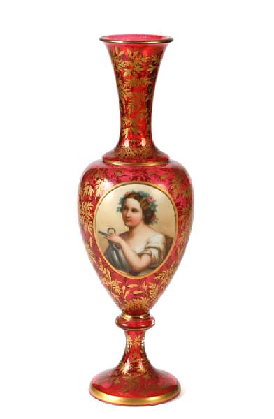 Appraisal: A Bohemian gilt heightened ruby glass vase with portrait panel