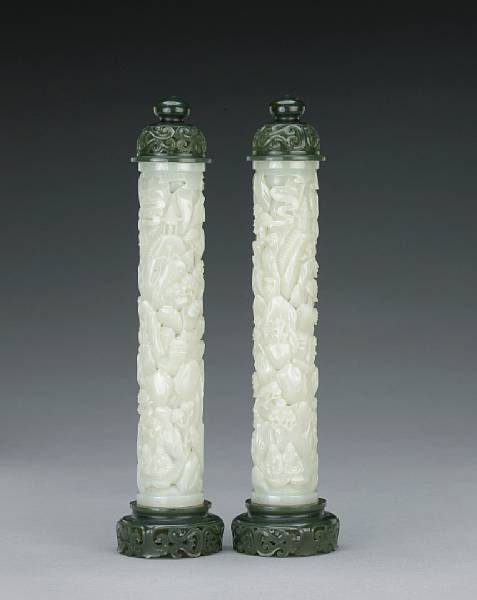 Appraisal: A pair of white jade reticulated cylinders with 'spinach' jade