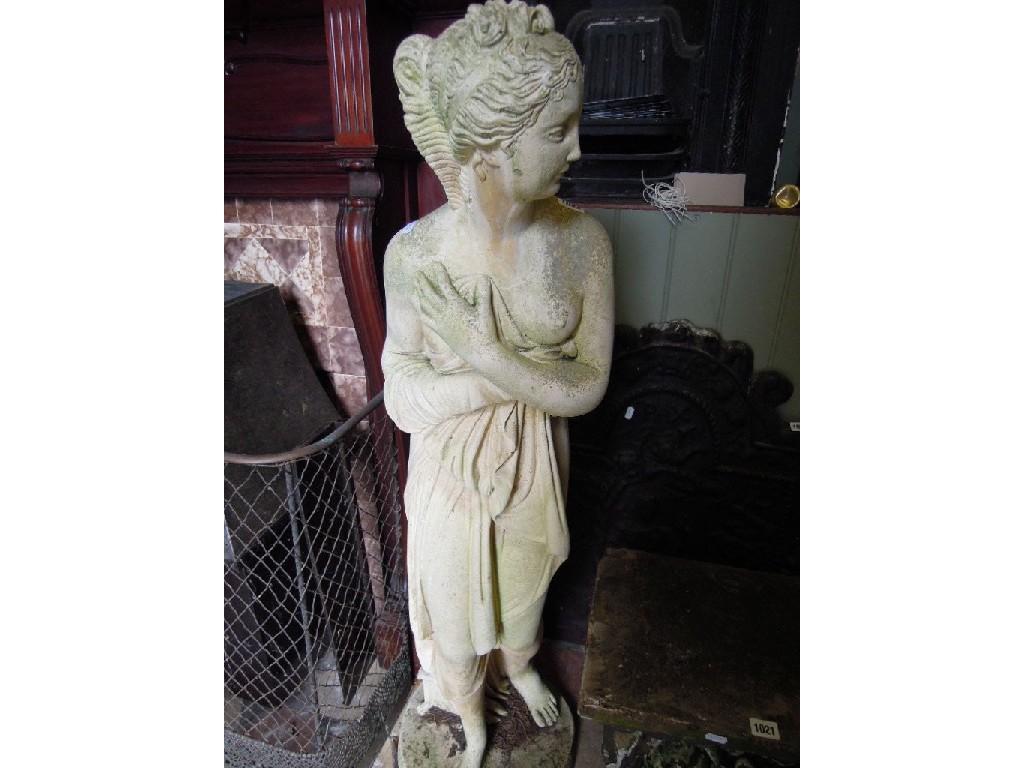 Appraisal: A weathered composition stone garden figure of a classically draped