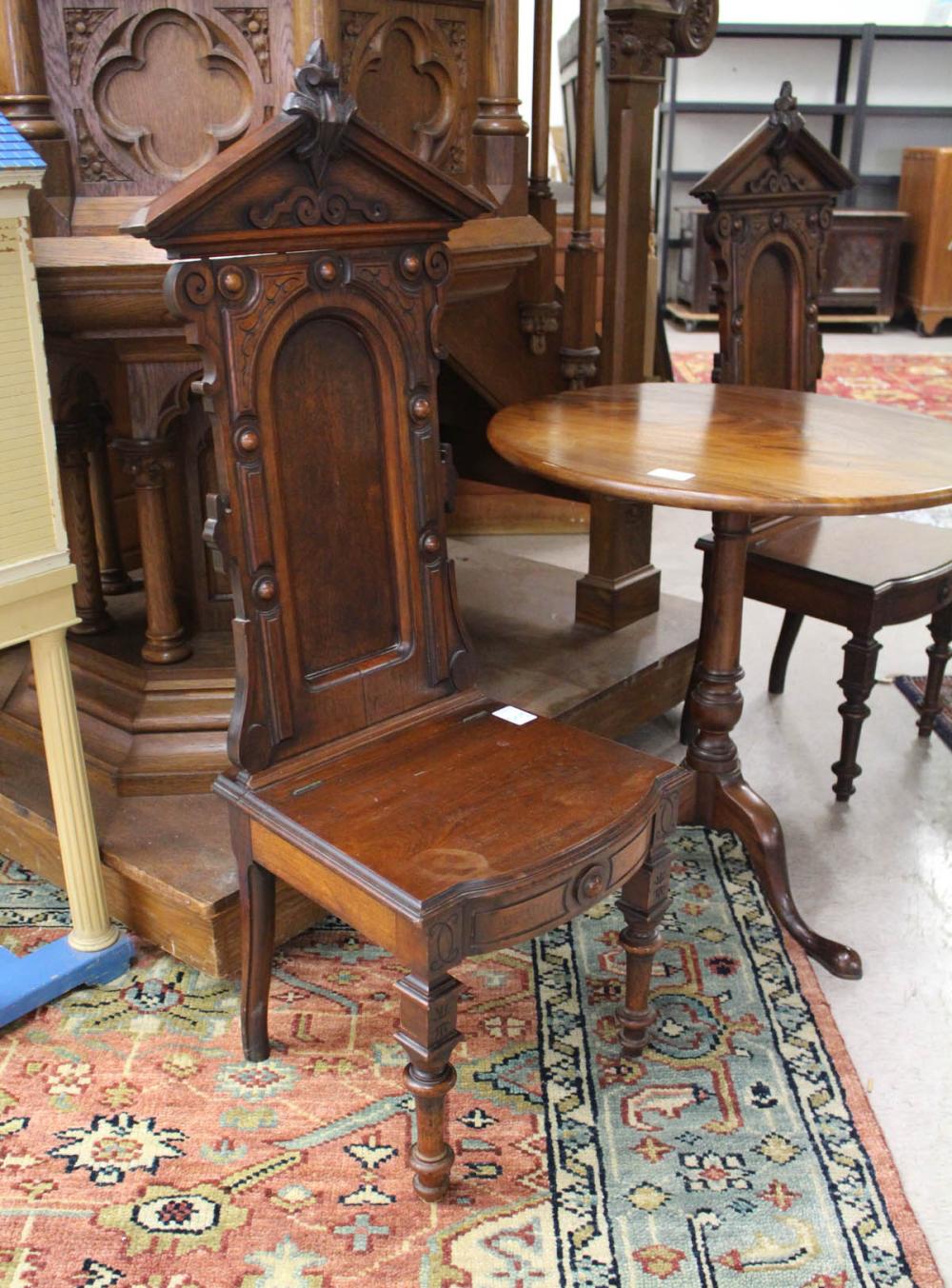 Appraisal: PAIR OF VICTORIAN HALL CHAIRS Eastlake design and lift-top seat