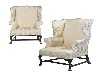 Appraisal: A PAIR OF WING ARMCHAIRS upholstered in ivory brocade on