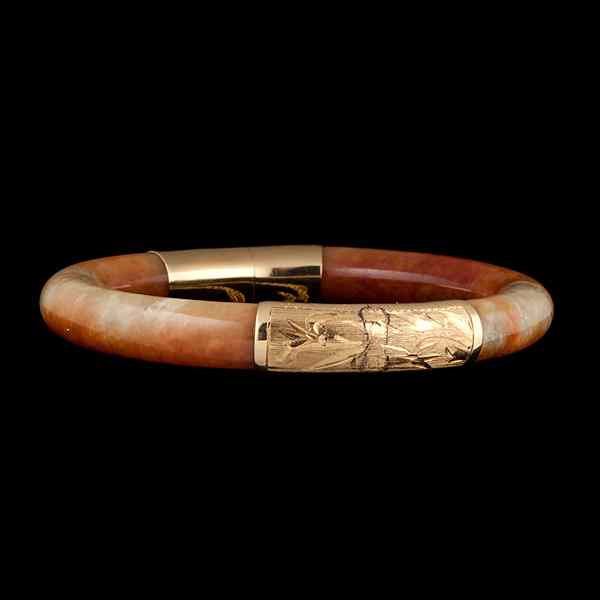 Appraisal: k Hinged Red Jade Bangle k yellow gold and red