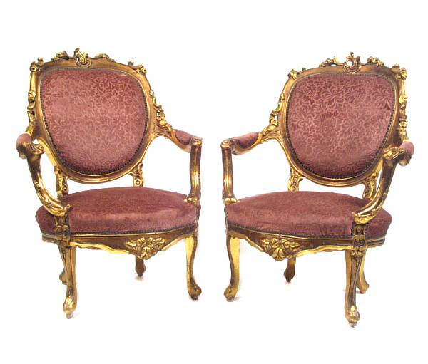 Appraisal: A set of four Louis XV style carved giltwood armchairs