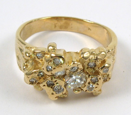 Appraisal: DIAMOND AND FOURTEEN KARAT GOLD RING set with round-cut diamonds