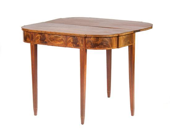 Appraisal: An American Mahogany Flip-Top Games Table the rectangular top with