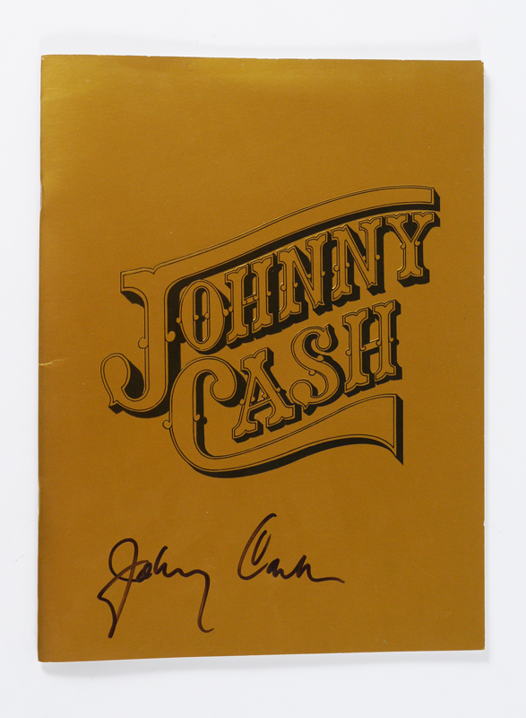 Appraisal: SIGNED JOHNNY CASH 'S TOUR PROGRAM Embossed gold cover signed