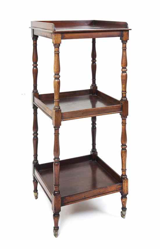 Appraisal: A Walnut Three-Tiered Stand the square three-quarter gallery top over