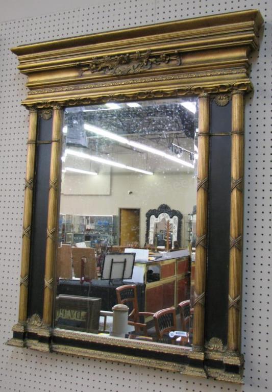 Appraisal: A French Empire style wall mirror decorator quality carved with