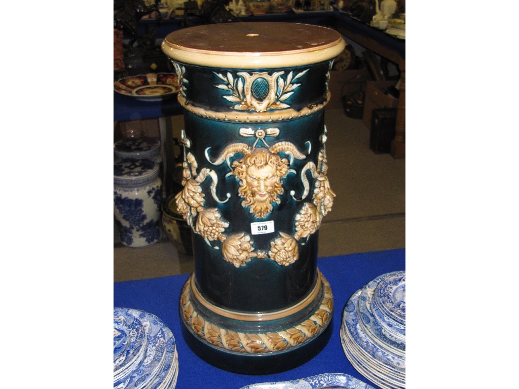 Appraisal: Pottery jardiniere stand decorated with a Bacchus and swags