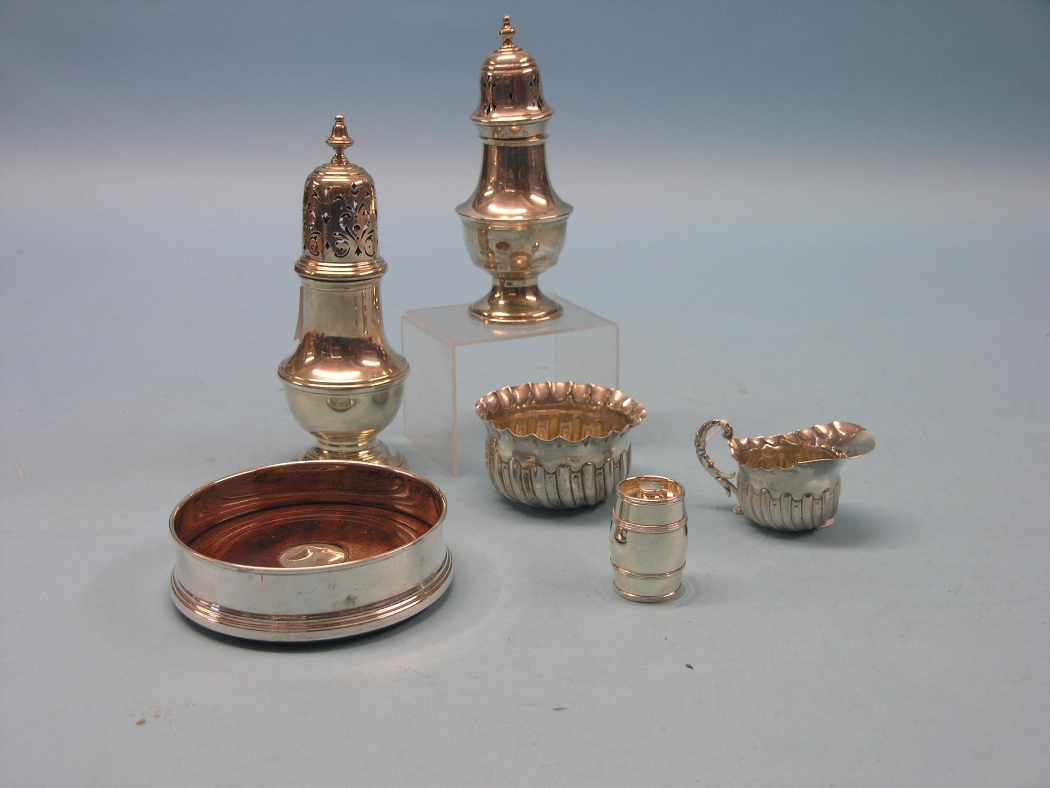 Appraisal: Two silver sugar casters and a wrythen silver cream jug