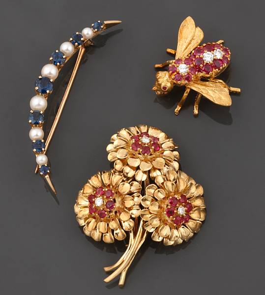 Appraisal: A collection of three gem-set k and k gold brooches