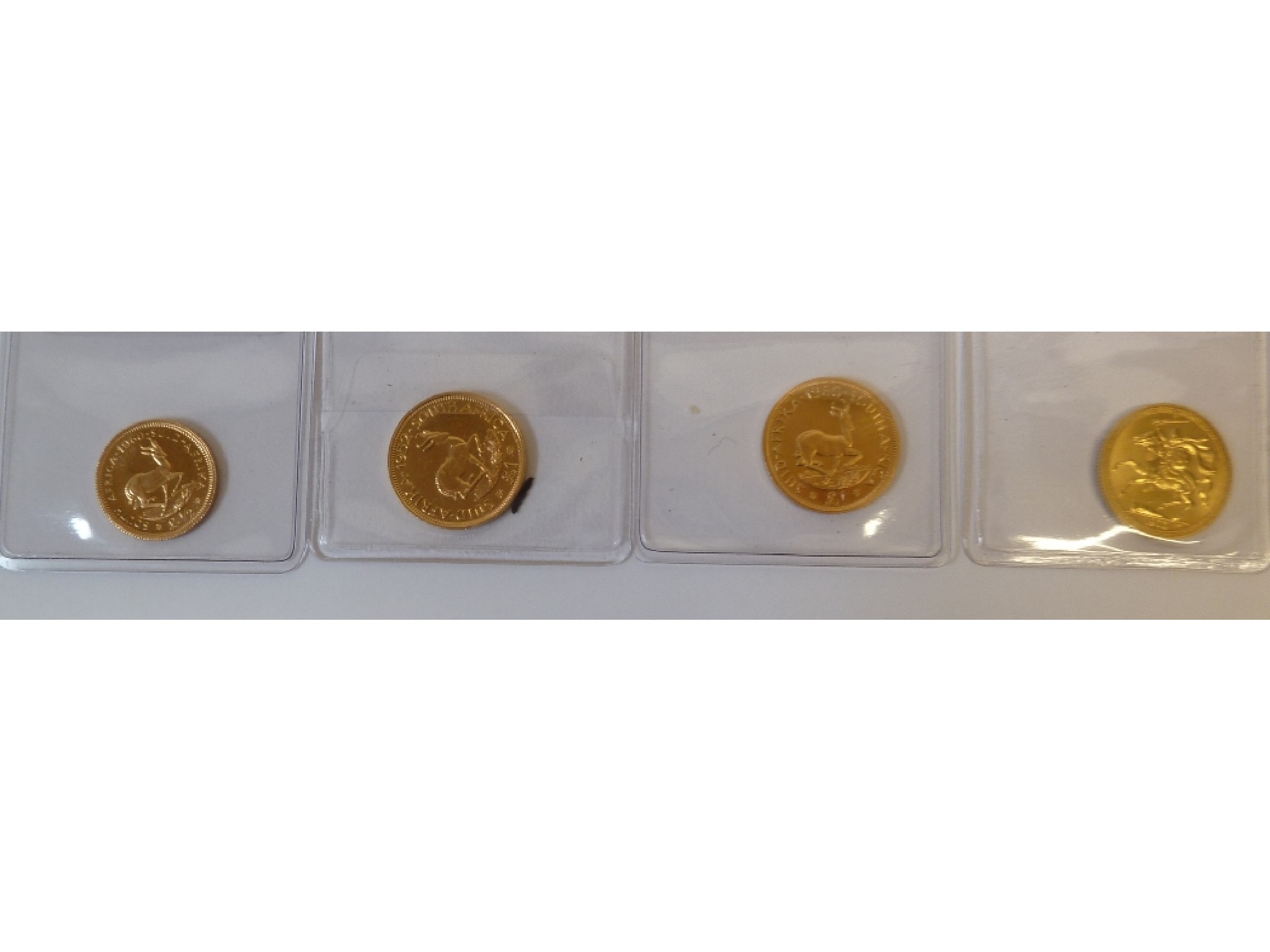 Appraisal: AN ELIZABETH II GOLD ISLE OF MAN SOVEREIGN together with