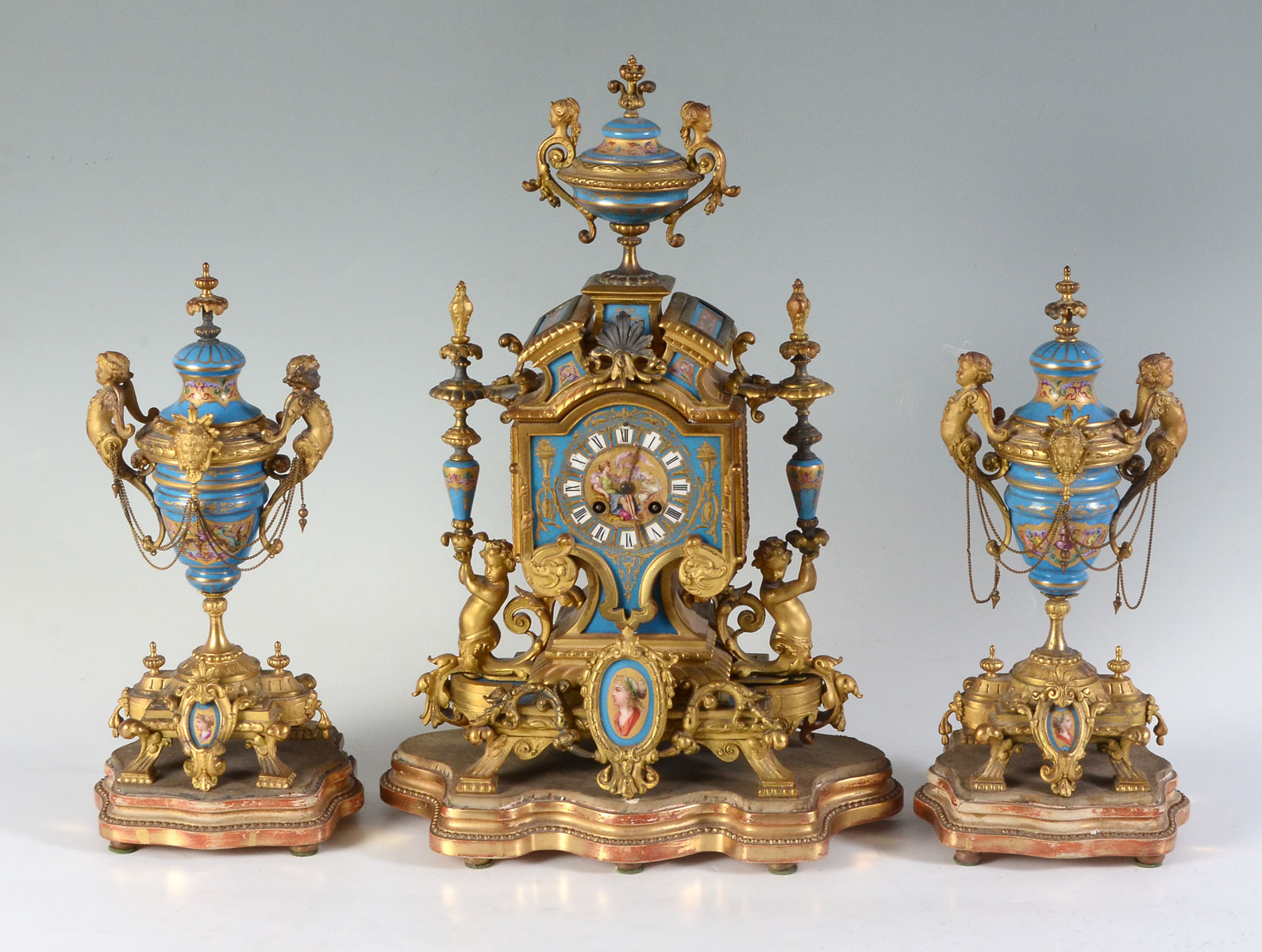 Appraisal: BRONZE AND PORCELAIN FRENCH CLOCK GARNITURE th C Japy Freres