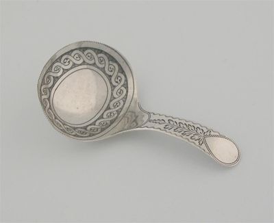 Appraisal: A George III caddy spoon oval bowl pricked decoration by