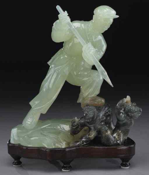 Appraisal: Chinese Cultural Revolution serpentine jadecarving depicting a soldier fighting two