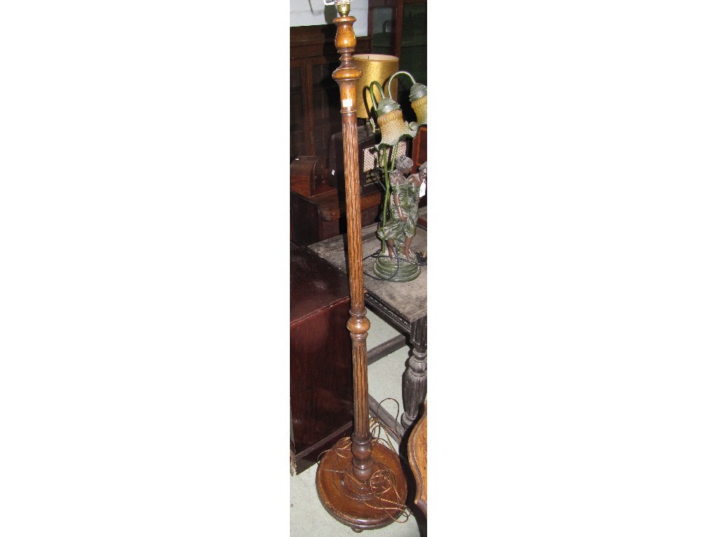 Appraisal: Mahogany bedside cupboard and fluted floor lamp