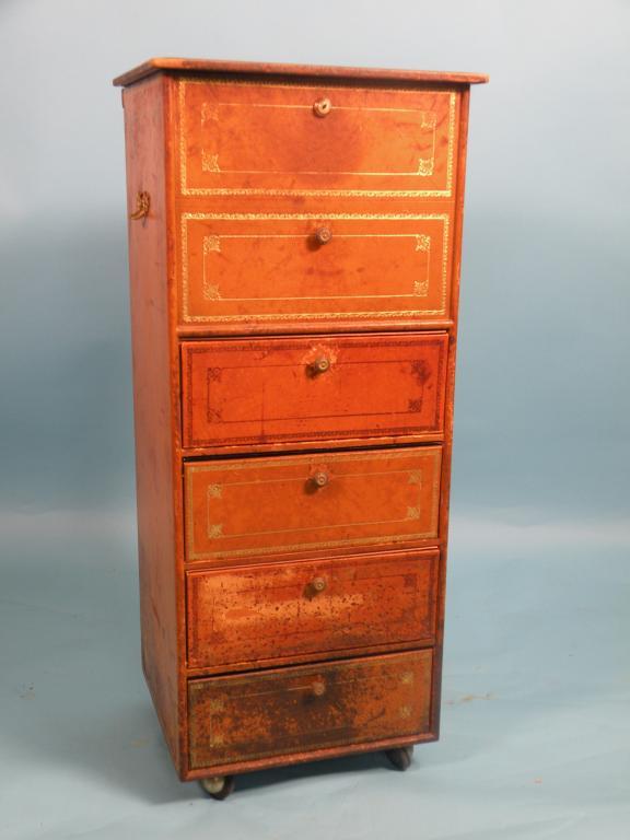 Appraisal: A French gilt tooled leather veneered chest with a hinged