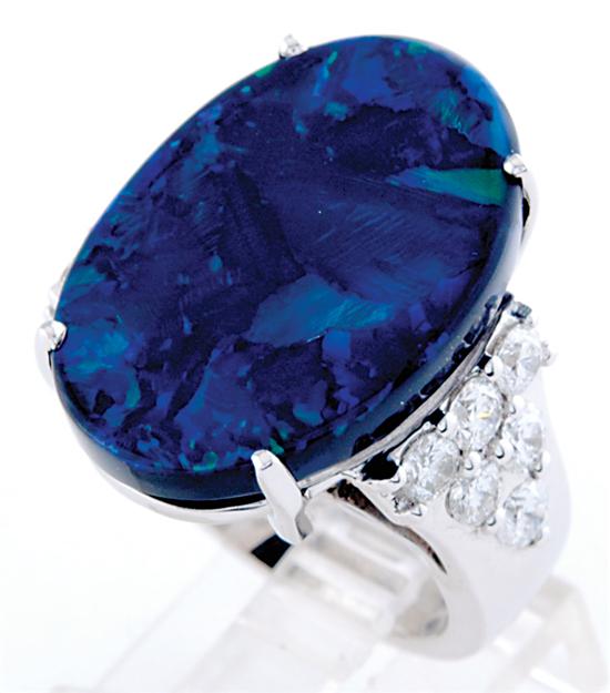 Appraisal: Black opal and diamond ring cabochon opal ct flanked by