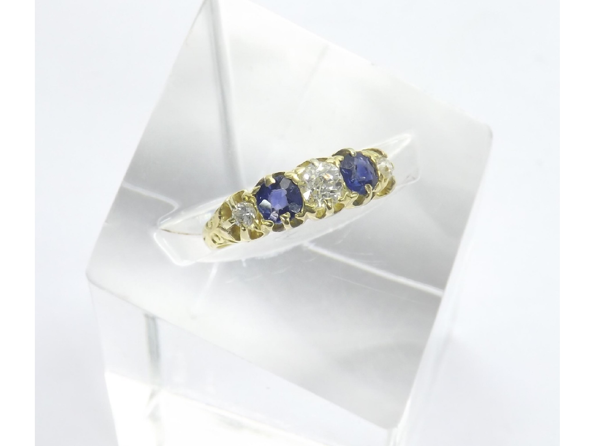 Appraisal: Antique ct yellow gold claw set sapphire and diamond five