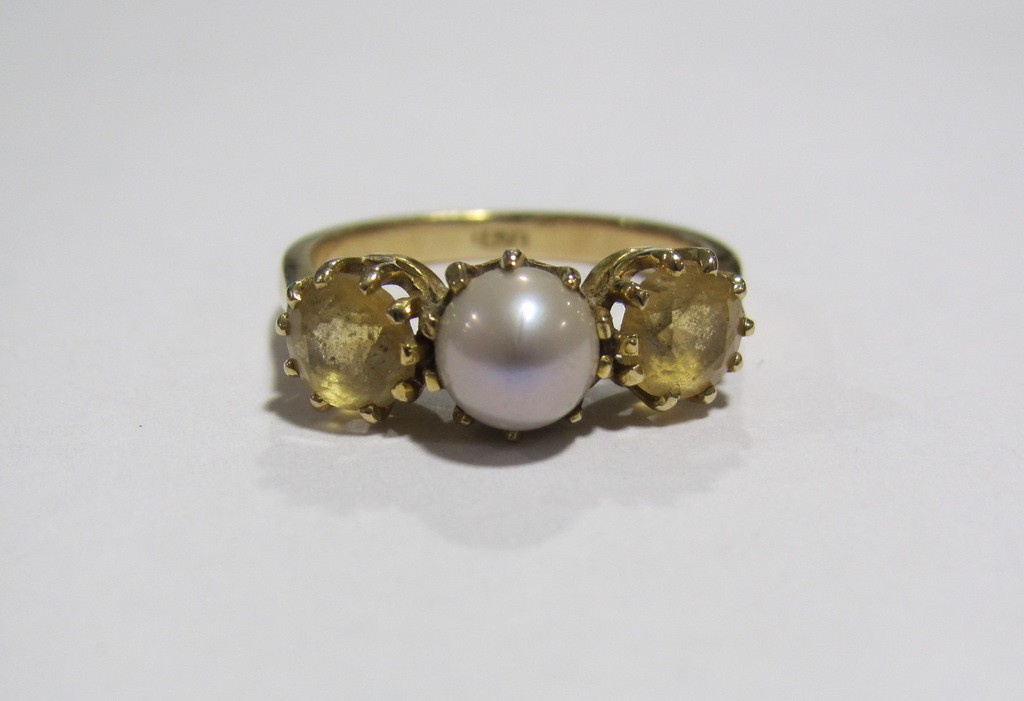 Appraisal: Nine carat gold citrine and pearl three stone ring