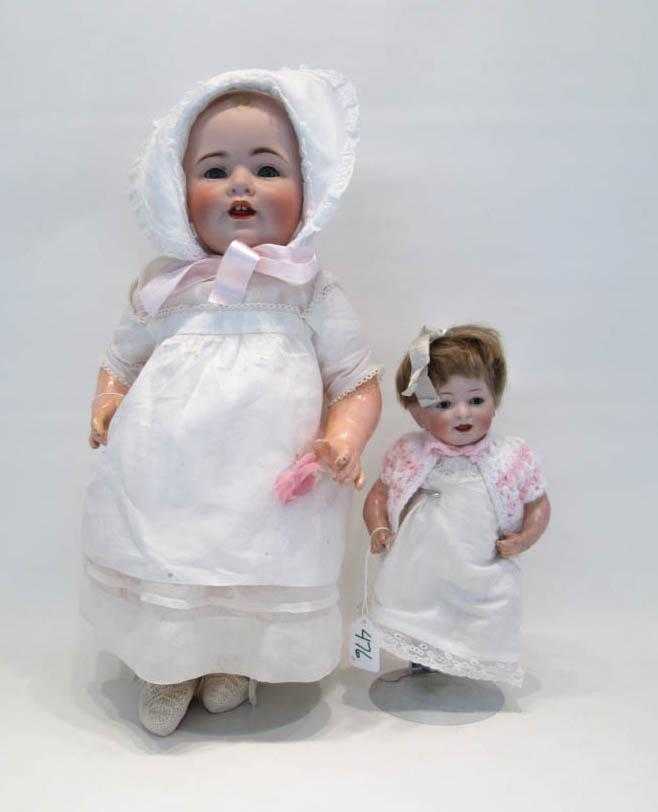 Appraisal: TWO J D KESTNER BISQUE SOCKET HEAD DOLLS the smallest