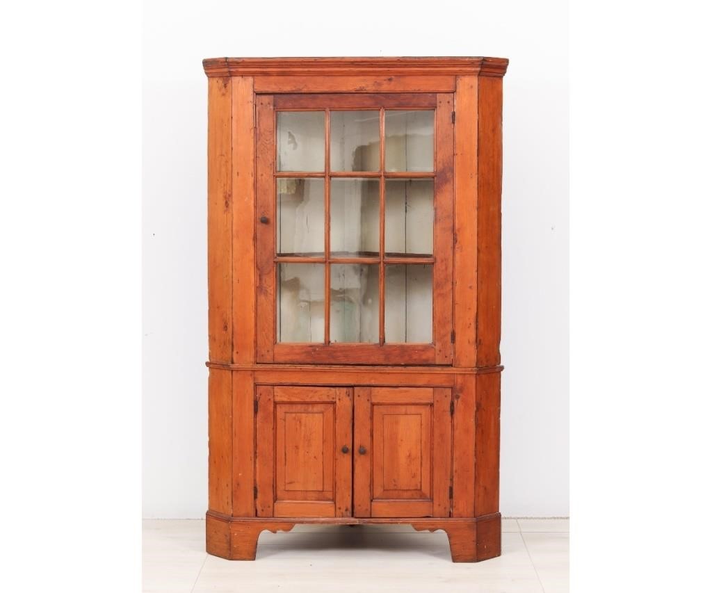 Appraisal: Two-piece pine corner cupboard circa with molded cornice above a