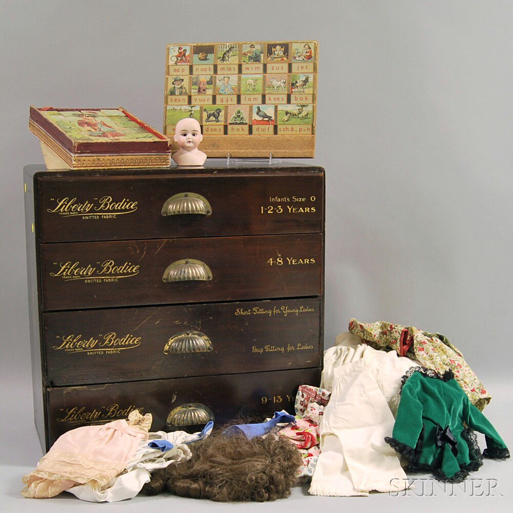 Appraisal: Doll Clothing Bureau with Contents four-drawer countertop store bureau with