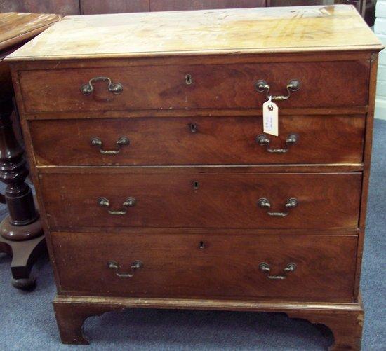 Appraisal: A George III fruitwood chest fitted four long graduated drawers