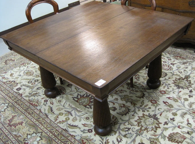 Appraisal: A SQUARE OAK DINING TABLE American c standing on five