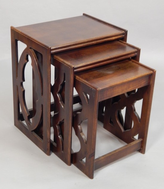 Appraisal: A nest of three retro style mahogany tables each on