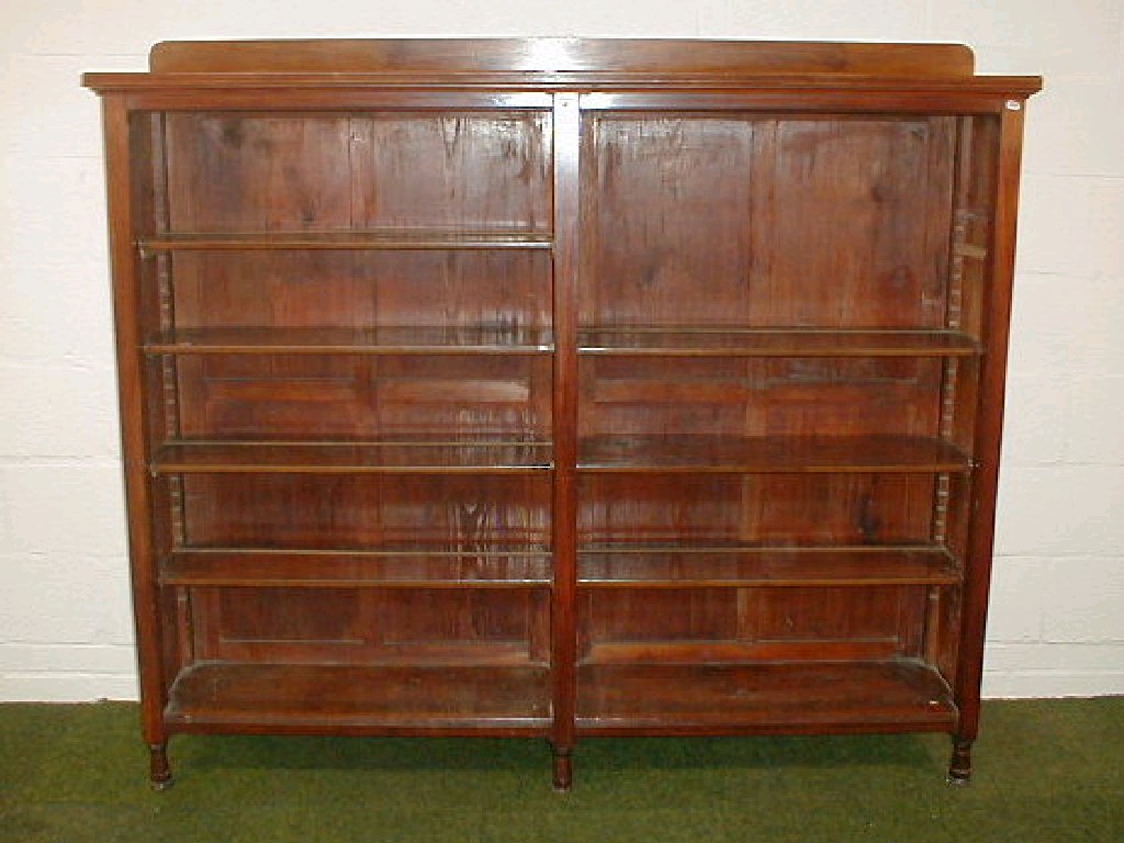 Appraisal: A late Victorian walnut open bookcase with an arrangement of