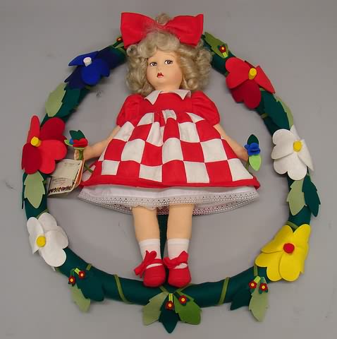 Appraisal: Lenci felt doll standing on a felt wreath Lenci Logo