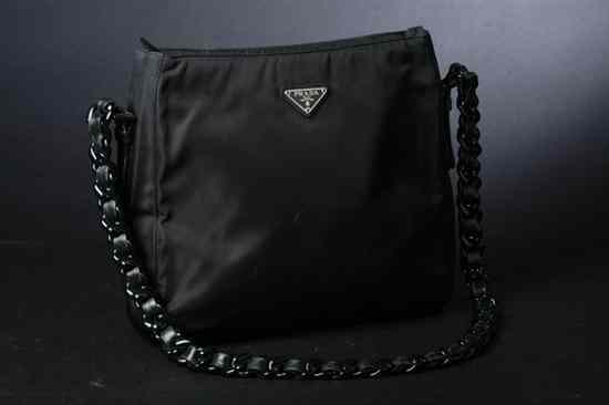 Appraisal: PRADA BLACK NYLON HANDBAG Divided interior with black plastic chain