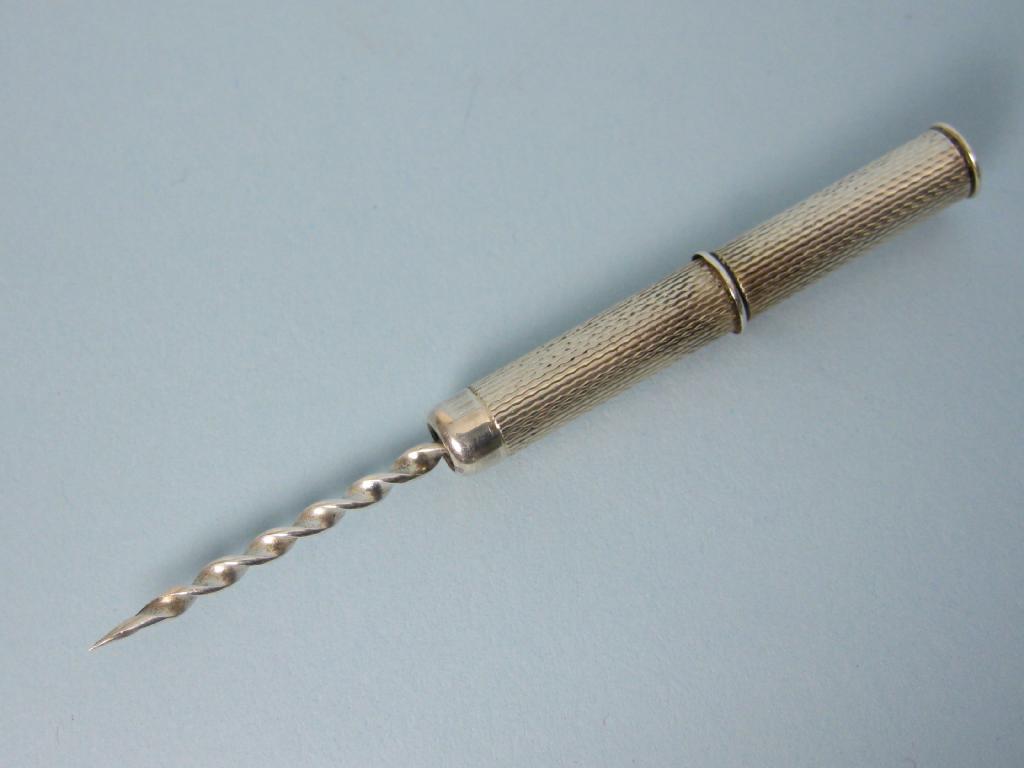 Appraisal: A sterling silver miniature Travelling Drill or Toothpick with engine