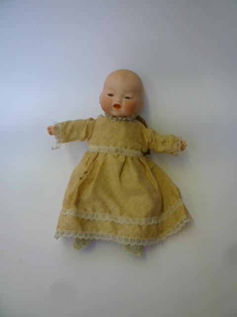 Appraisal: An Armand Marseille bisque head baby doll with blue glass