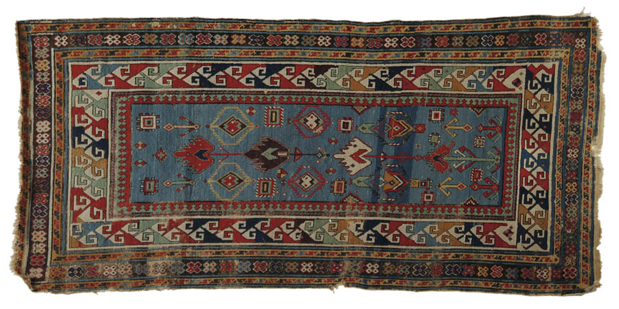 Appraisal: ANTIQUE CAUCASIAN SCATTER RUG Multiple borders surround a rectangular medium