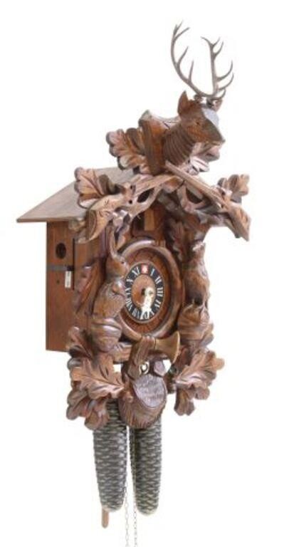 Appraisal: Swiss Black Forest style carved cuckoo clock Lotscher stag-head mount