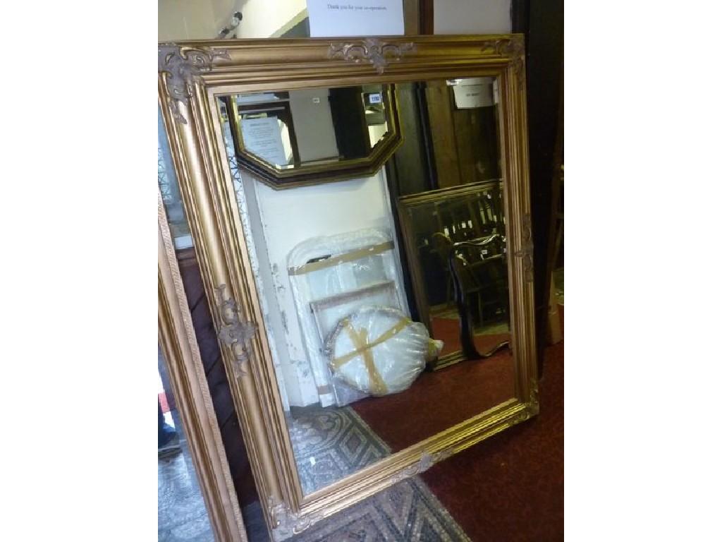 Appraisal: A large contemporary wall mirror of rectangular form with moulded