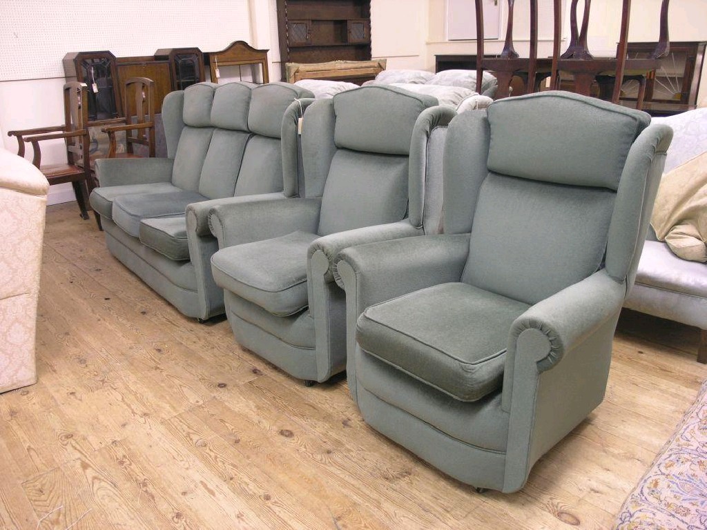 Appraisal: A three piece suite consisting of three seater wing settee