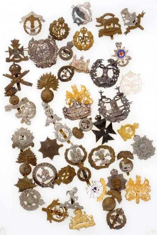 Appraisal: FORTY-SIX BRITISH ARMY CAP BADGES of brass some gilt silver