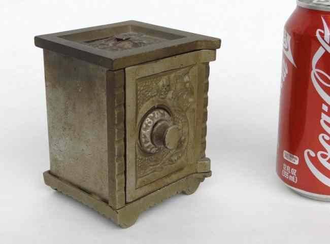 Appraisal: Early nickel plated iron safe bank with combination dial ''