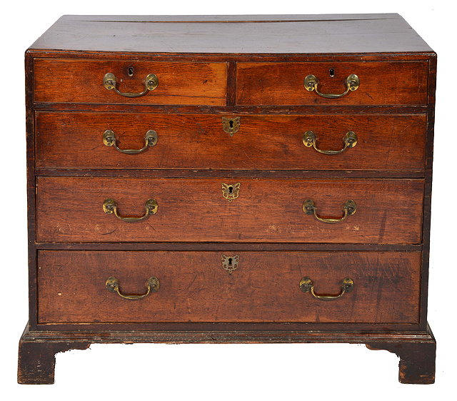 Appraisal: A GEORGIAN OAK CADDY TOPPED CHEST of two short and