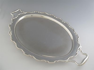 Appraisal: A large modern two handled oval tray with a shaped