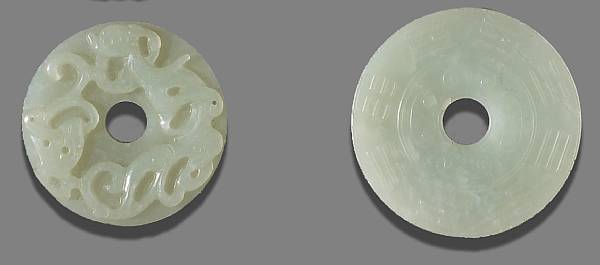 Appraisal: Two off-white jade bi disks Each centered with a circular