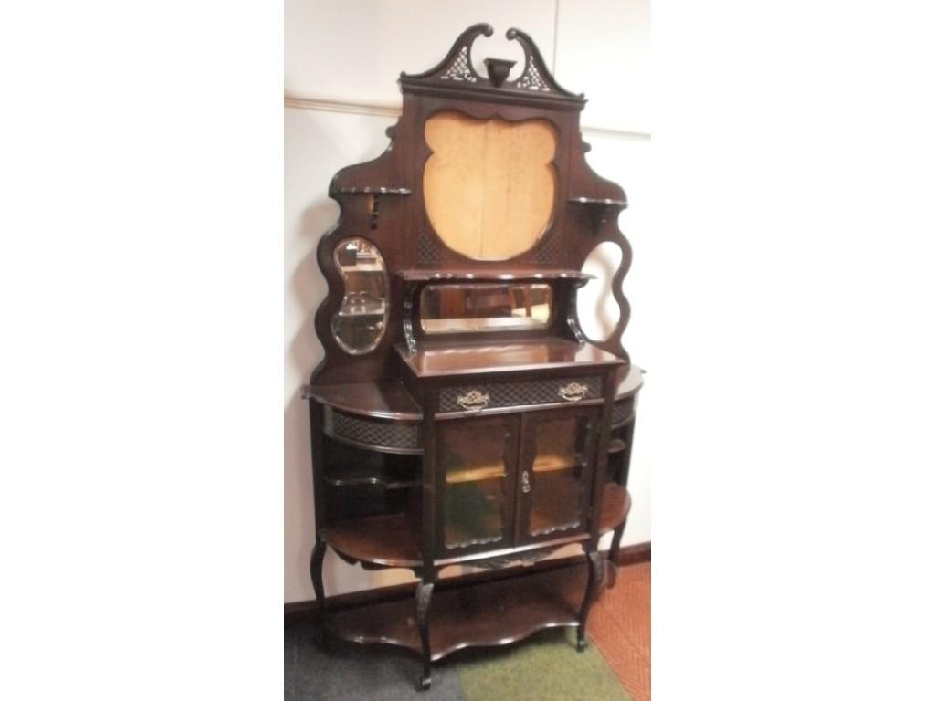 Appraisal: A late Victorian mahogany display cabinet with a pierced swan