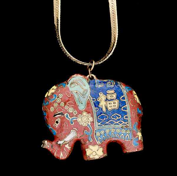 Appraisal: Enameled Asian Elephant An enameled Elephant with Asian characters decorating