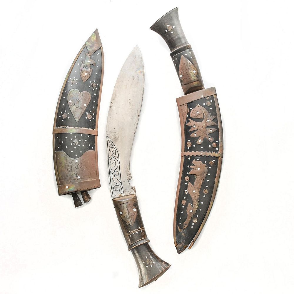 Appraisal: PAIR OF NEPALESE KUKRI KNIVES WITH ELABORATE SCABBARDS Water buffalo