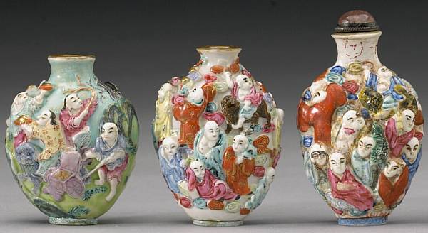 Appraisal: Four molded porcelain snuff bottles th Century The first crisply